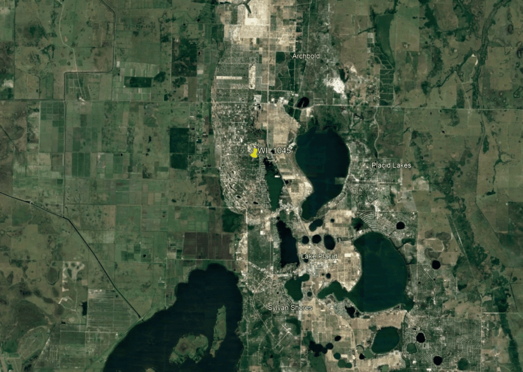 Satellite map of the Lake Placid, FL area showing downtown, surrounding lakes, and labeled spots like Archbold and Placid Lakes. A yellow pin marks WIL 1045 near the town center.