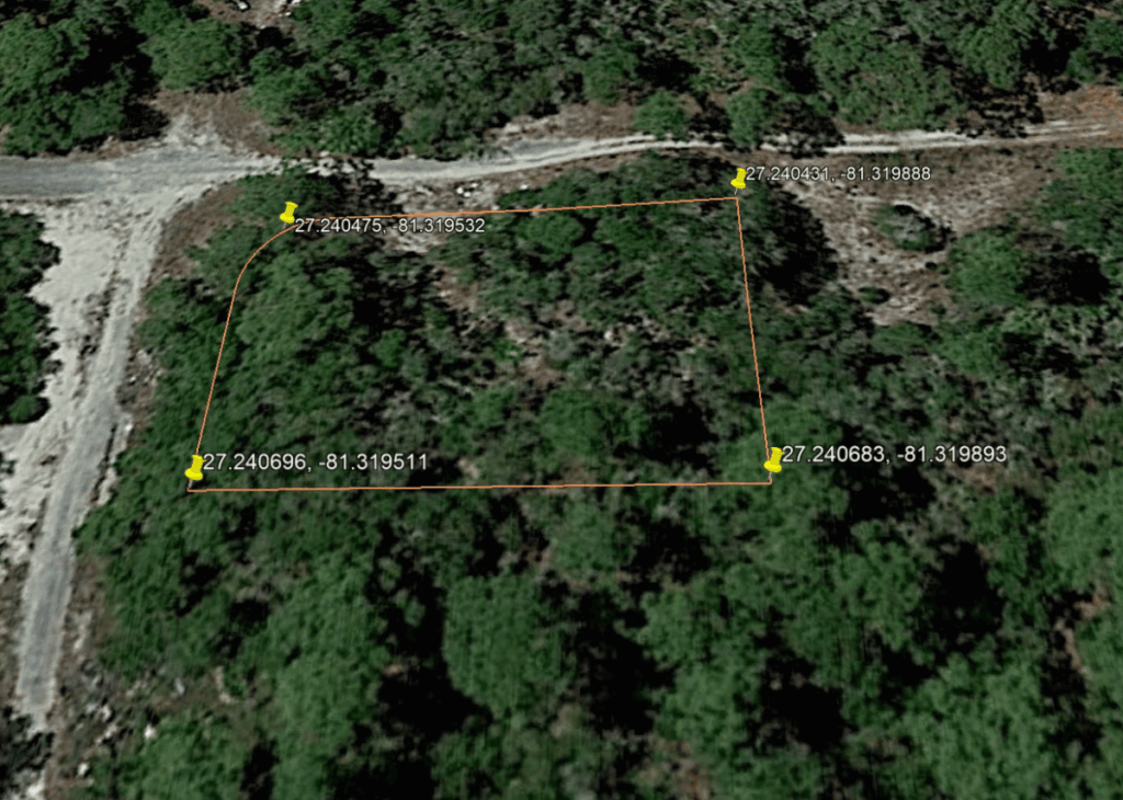 Aerial view of a wooded parcel bordered by orange lines with yellow pins at its four corners and GPS coords shown: 27.240431, -81.319888; 27.240431, -81.319893; 27.240696, -81.319511; 27.240475, -81.319532; 27.240683, -81.319893.