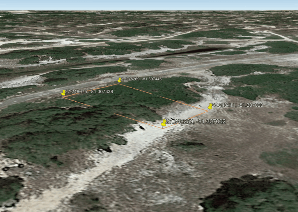 3D satellite view of a small land parcel outlined in orange with five GPS-tagged boundary pins in a scrubby, sandy landscape.